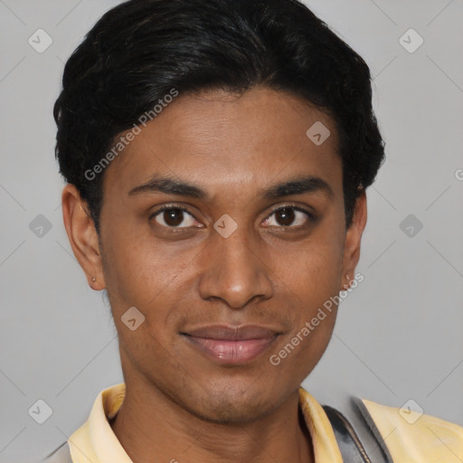 Joyful latino young-adult male with short  black hair and brown eyes