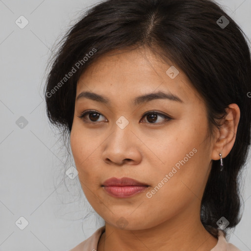 Joyful asian young-adult female with long  brown hair and brown eyes