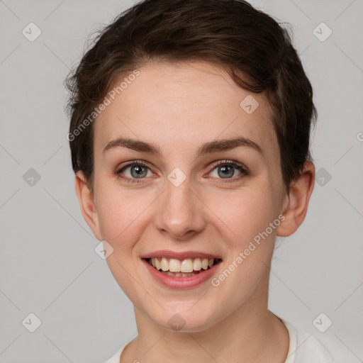 Joyful white young-adult female with short  brown hair and grey eyes