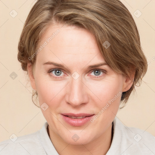 Joyful white adult female with medium  brown hair and blue eyes