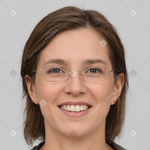 Joyful white adult female with medium  brown hair and grey eyes