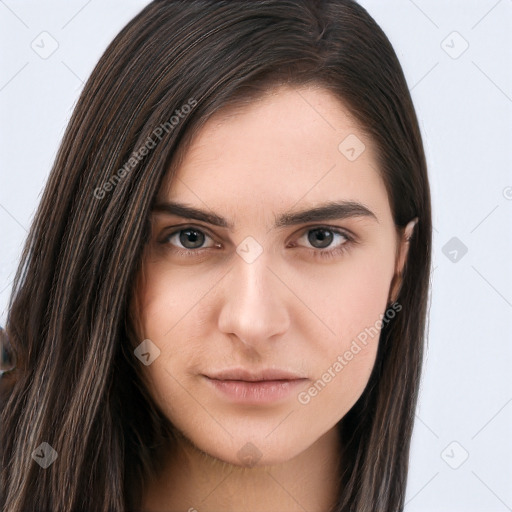 Neutral white young-adult female with long  brown hair and brown eyes