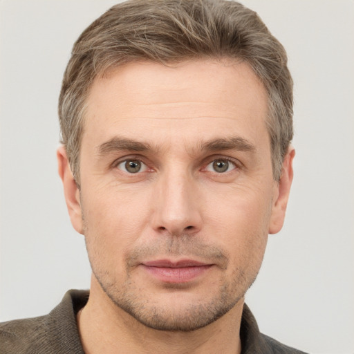 Neutral white adult male with short  brown hair and grey eyes