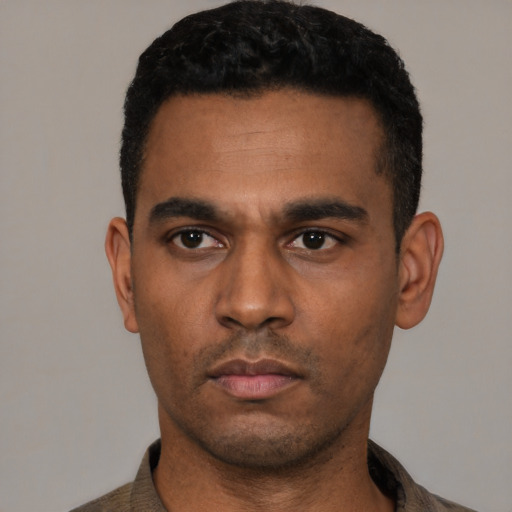 Neutral latino young-adult male with short  black hair and brown eyes