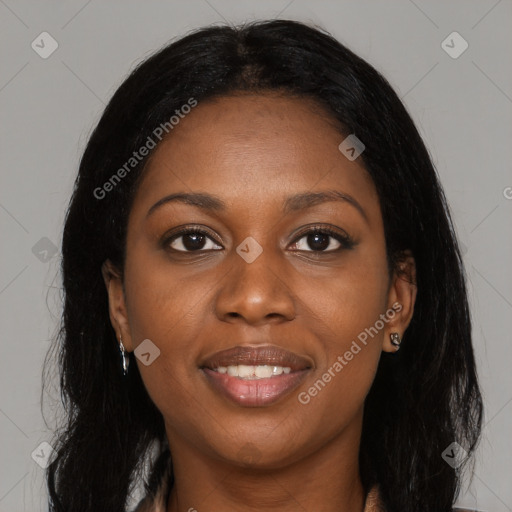 Joyful black young-adult female with long  brown hair and brown eyes