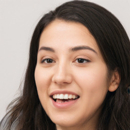 Joyful white young-adult female with long  black hair and brown eyes