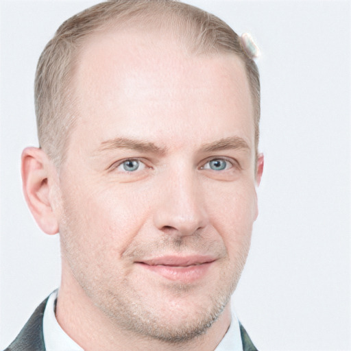 Joyful white young-adult male with short  brown hair and blue eyes