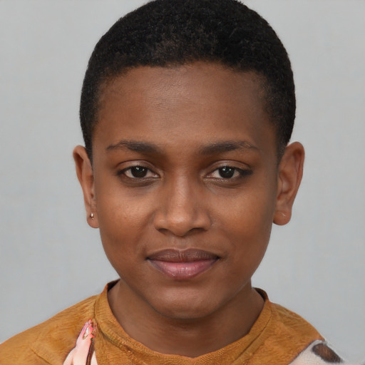 Joyful black young-adult female with short  brown hair and brown eyes