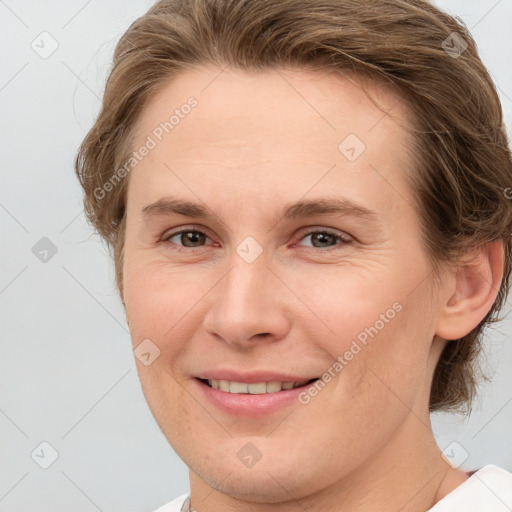 Joyful white young-adult female with short  brown hair and grey eyes