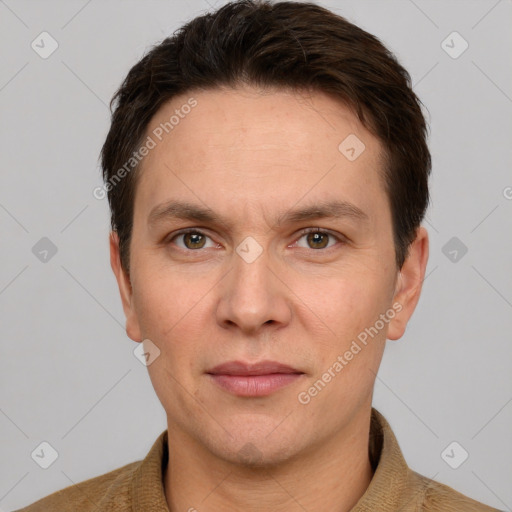 Joyful white adult male with short  brown hair and grey eyes