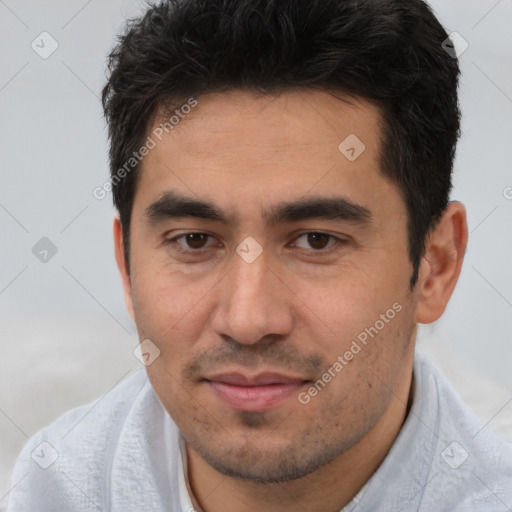 Joyful white young-adult male with short  black hair and brown eyes