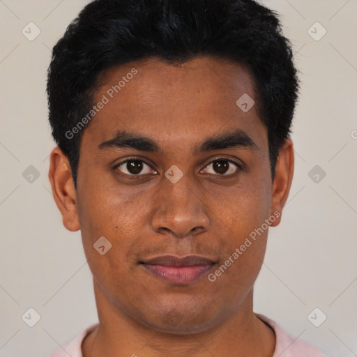 Joyful black young-adult male with short  black hair and brown eyes