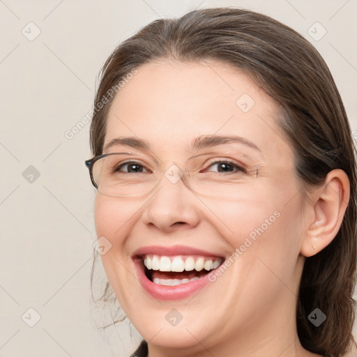 Joyful white adult female with medium  brown hair and brown eyes