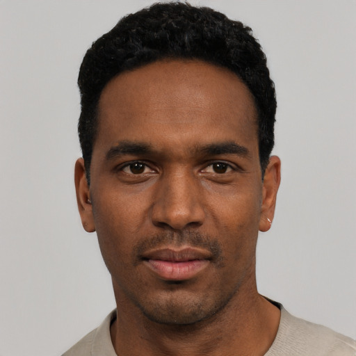 Neutral black young-adult male with short  black hair and brown eyes
