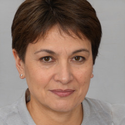 Joyful white adult female with short  brown hair and brown eyes