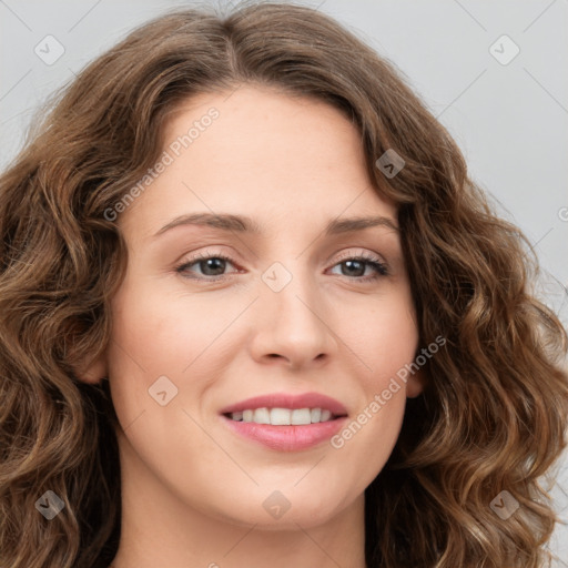 Joyful white young-adult female with long  brown hair and green eyes