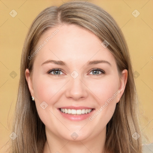 Joyful white young-adult female with long  brown hair and grey eyes