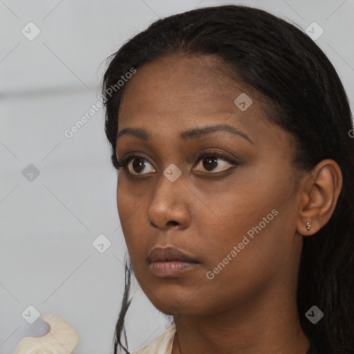 Neutral black young-adult female with short  black hair and brown eyes