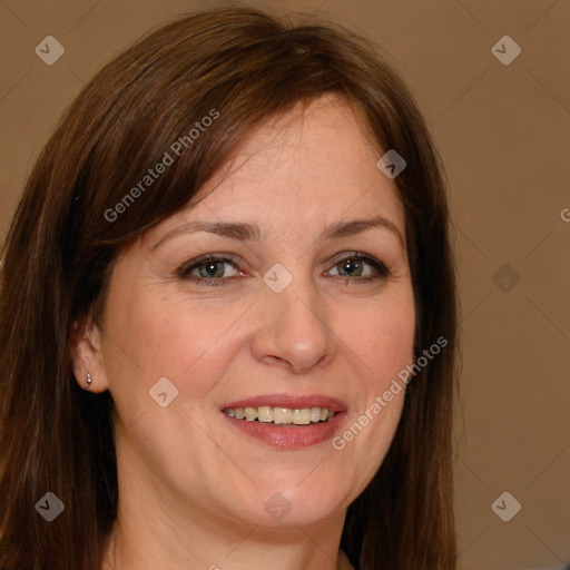 Joyful white adult female with long  brown hair and brown eyes