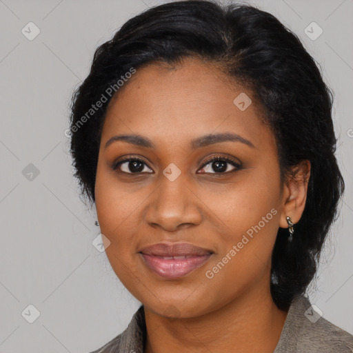 Joyful black young-adult female with long  black hair and brown eyes