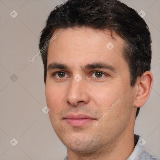 Joyful white young-adult male with short  brown hair and brown eyes