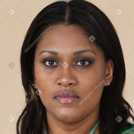 Joyful black young-adult female with long  black hair and brown eyes