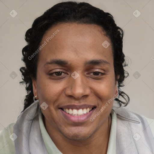 Joyful black young-adult male with short  brown hair and brown eyes