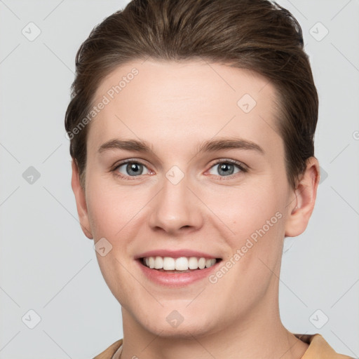 Joyful white young-adult female with short  brown hair and grey eyes