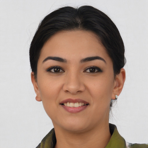 Joyful asian young-adult female with short  black hair and brown eyes