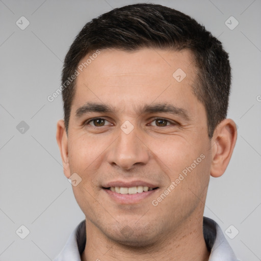 Joyful white young-adult male with short  brown hair and brown eyes