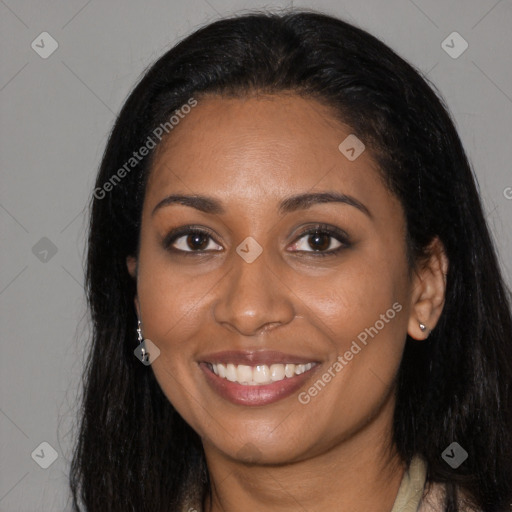 Joyful black young-adult female with long  black hair and brown eyes