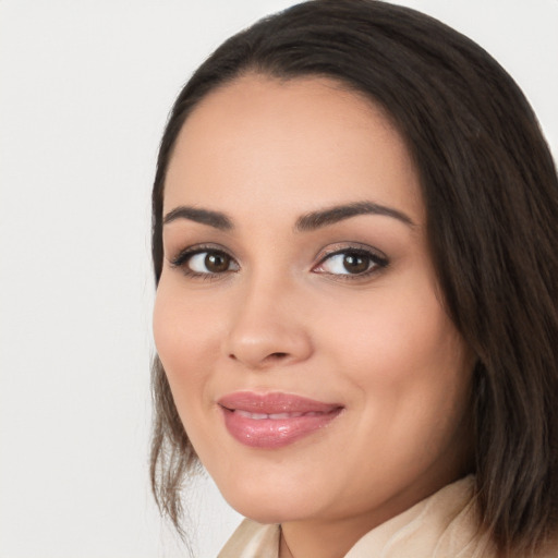 Joyful white young-adult female with long  black hair and brown eyes