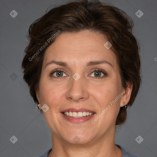 Joyful white adult female with short  brown hair and brown eyes