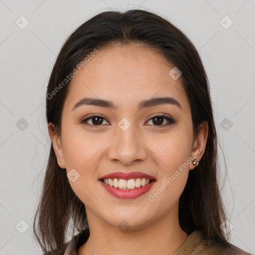 Joyful latino young-adult female with long  brown hair and brown eyes