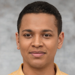 Joyful latino young-adult male with short  brown hair and brown eyes