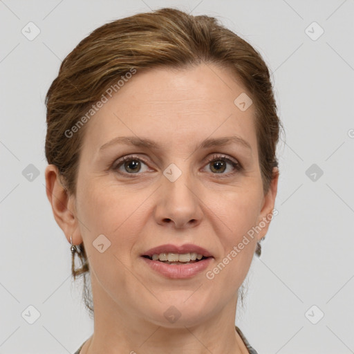 Joyful white adult female with short  brown hair and grey eyes