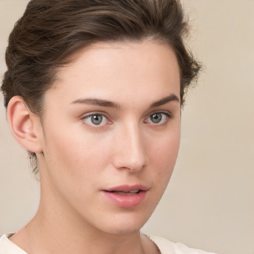 Neutral white young-adult female with short  brown hair and brown eyes