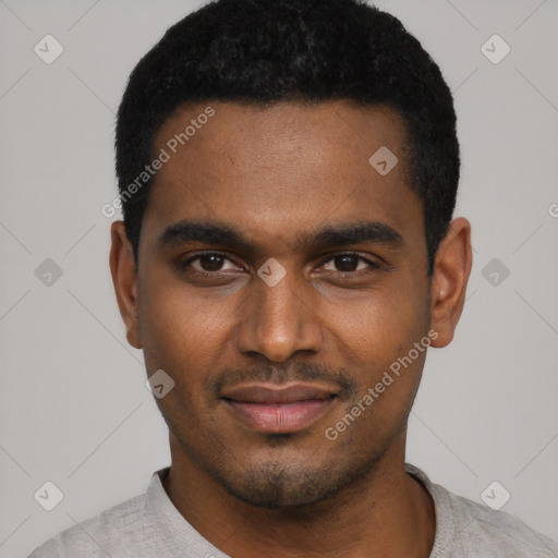 Joyful black young-adult male with short  black hair and brown eyes