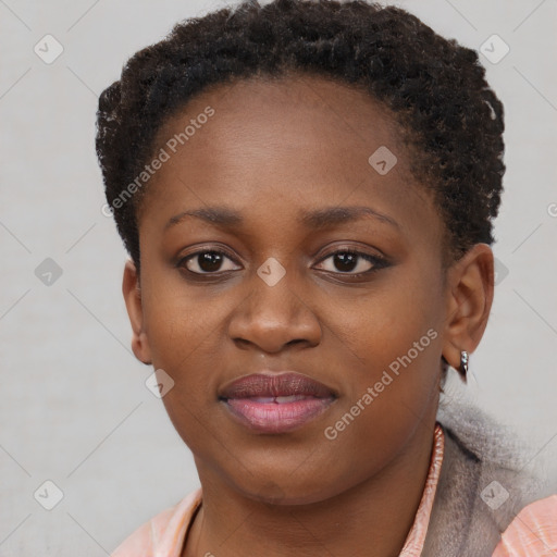 Joyful black young-adult female with short  brown hair and brown eyes