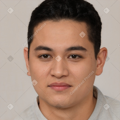 Joyful latino young-adult male with short  brown hair and brown eyes