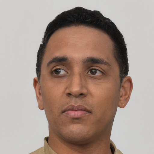 Neutral latino young-adult male with short  black hair and brown eyes