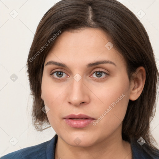 Neutral white young-adult female with medium  brown hair and brown eyes