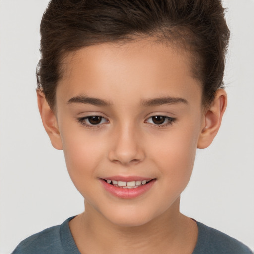 Joyful white child female with short  brown hair and brown eyes