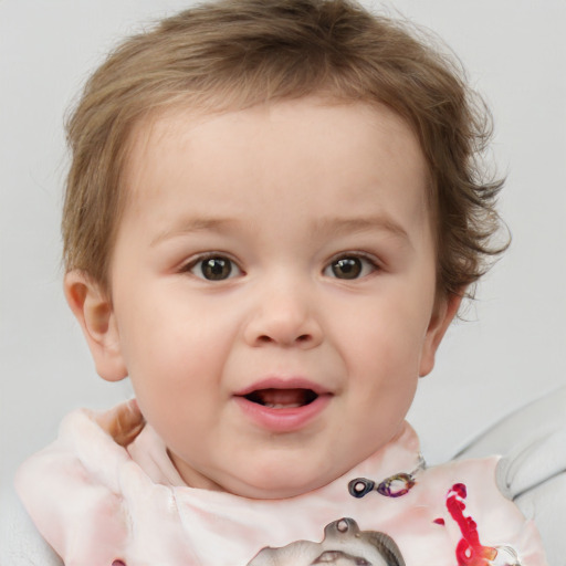 Joyful white child female with short  brown hair and blue eyes