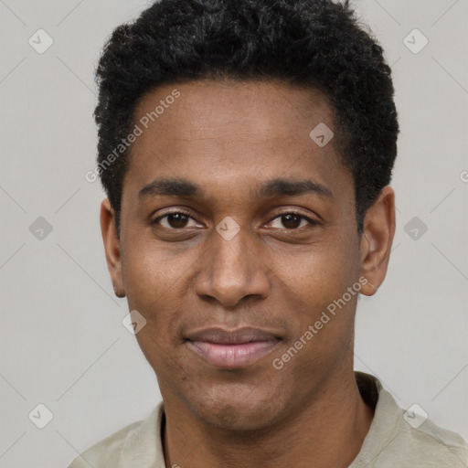 Joyful black young-adult male with short  black hair and brown eyes