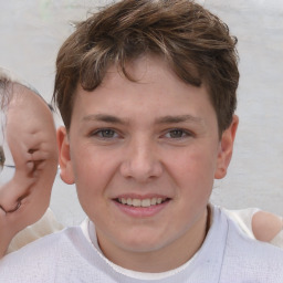 Joyful white child male with short  brown hair and brown eyes