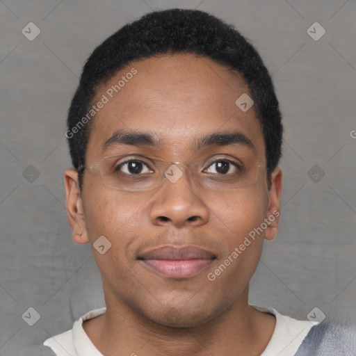 Joyful black young-adult male with short  brown hair and brown eyes