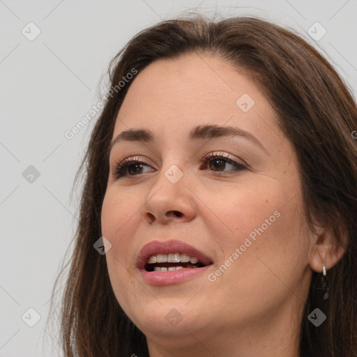 Joyful white young-adult female with long  brown hair and brown eyes