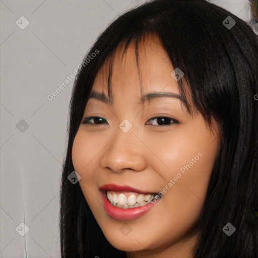 Joyful asian young-adult female with long  black hair and brown eyes