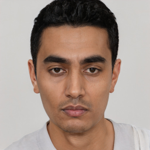 Neutral latino young-adult male with short  black hair and brown eyes